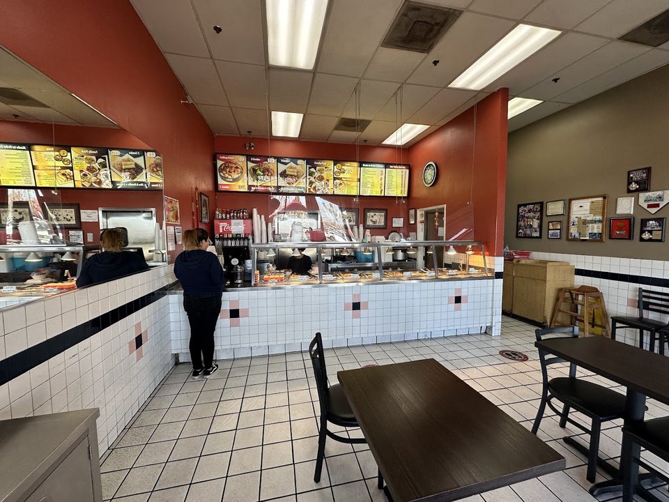 Chinese restaurant storefront in a strip mall.